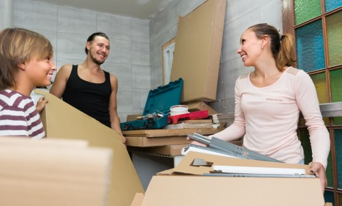 Removal team planning a home move in Southall street with local houses
