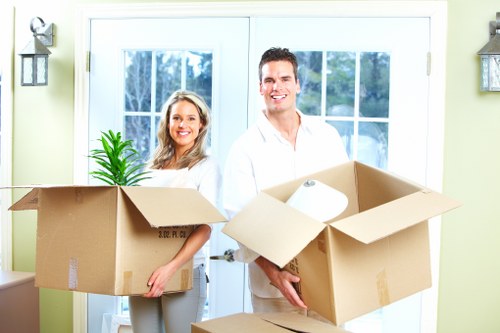 Packed moving boxes and furniture ready for house removal in Southall