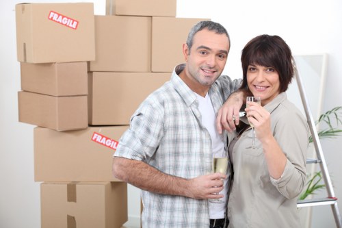 Professional movers handling boxes and household items